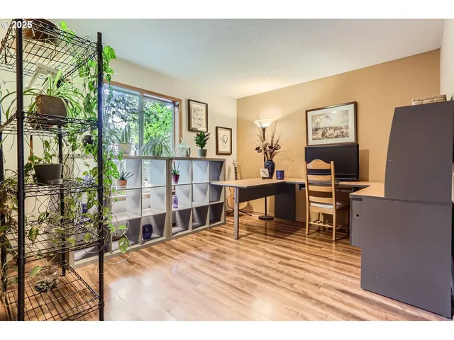a living room with furniture wooden floor and a table