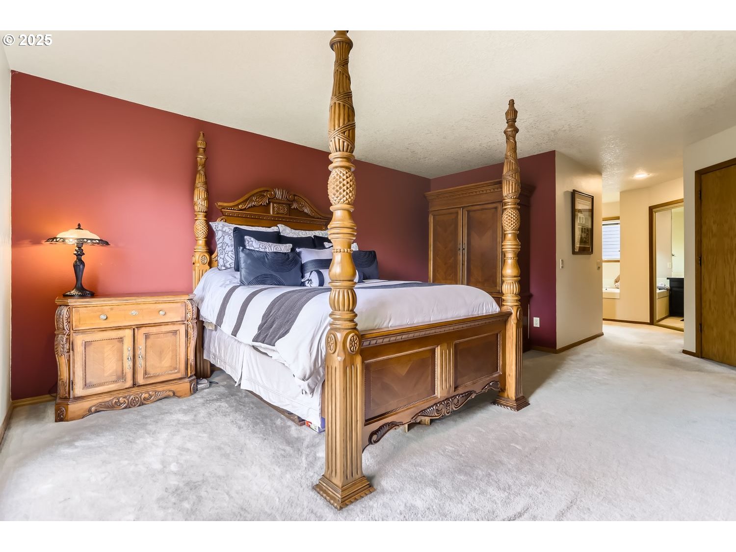14525 Southwest Chesterfield Lane Portland, OR 97224 - Photo 17 of 31 a view of a bedroom with furniture and a chandelier