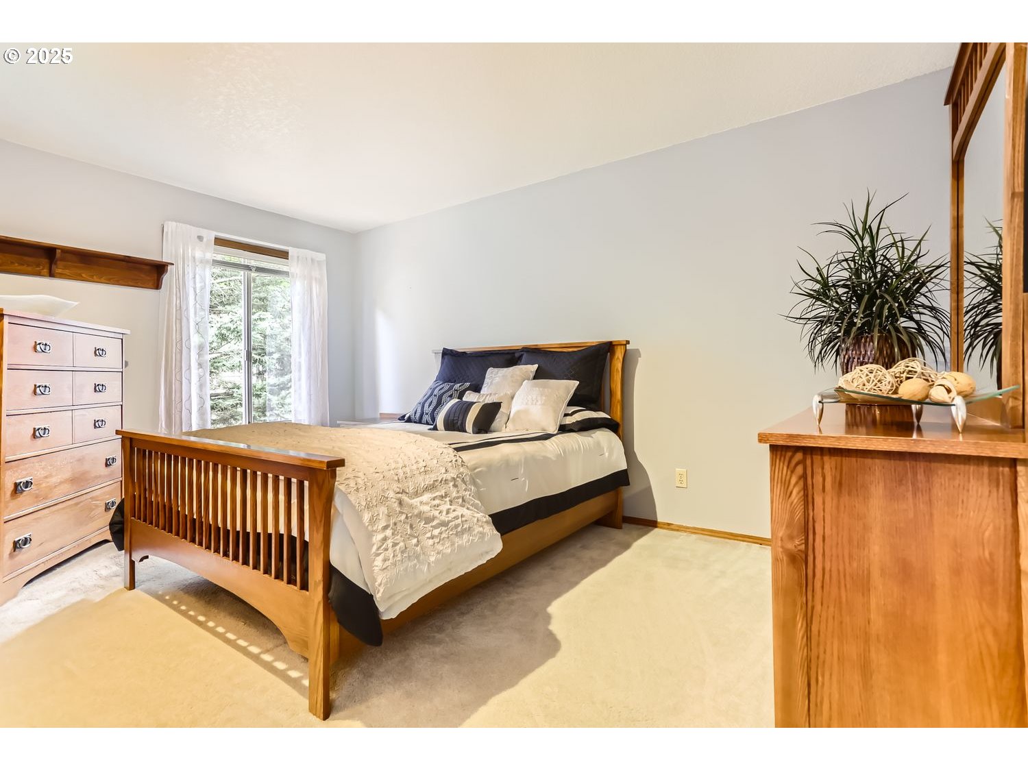 14525 Southwest Chesterfield Lane Portland, OR 97224 - Photo 21 of 31 a bedroom with a bed window and a potted plant