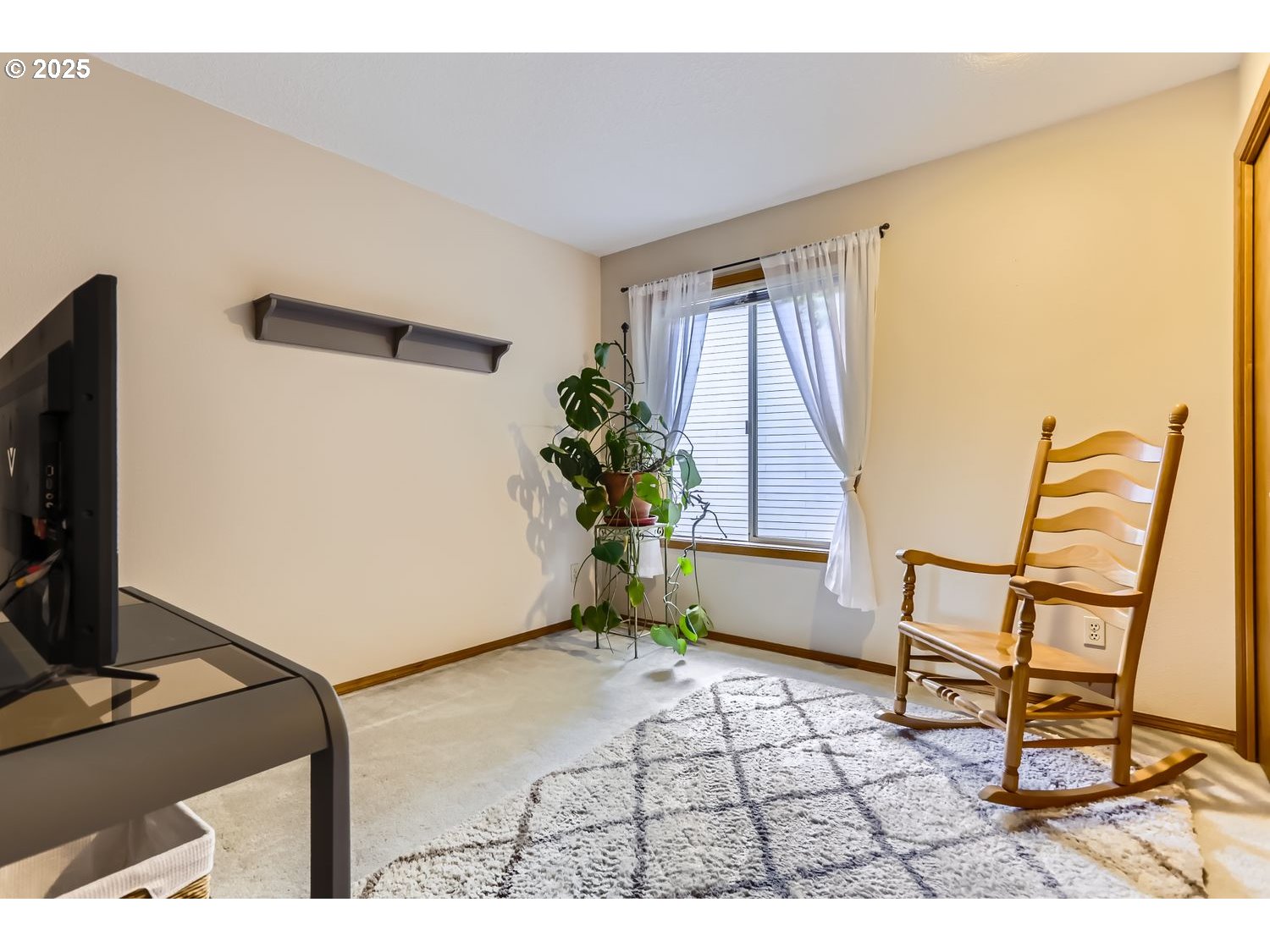 14525 Southwest Chesterfield Lane Portland, OR 97224 - Photo 22 of 31 a living room with furniture and a flat screen tv