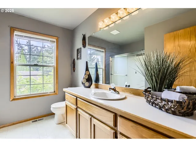 a view of a patio with table and chairs with wooden floor and fence