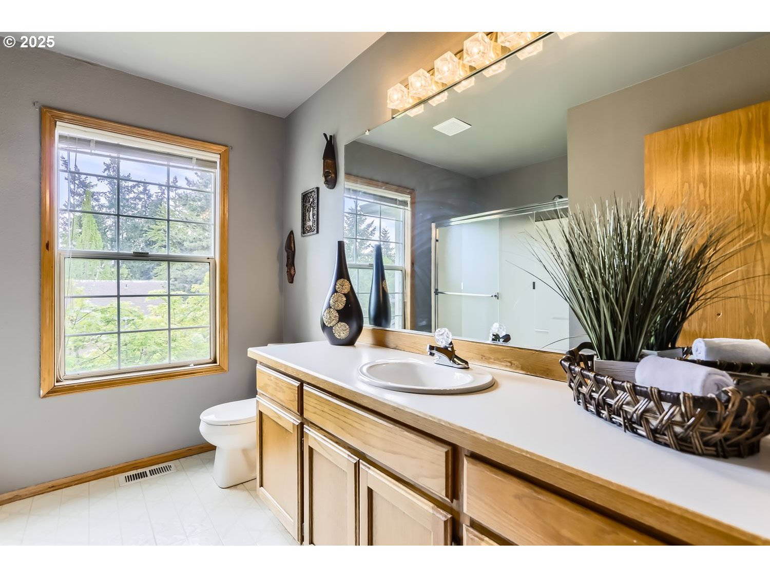 14525 Southwest Chesterfield Lane Portland, OR 97224 - Photo 23 of 31 a bathroom with a granite countertop sink mirror vanity and toilet