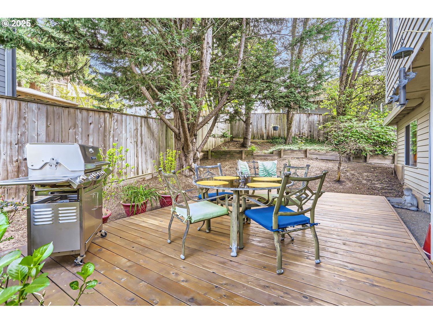 14525 Southwest Chesterfield Lane Portland, OR 97224 - Photo 24 of 31 a view of a patio with table and chairs with wooden floor and fence