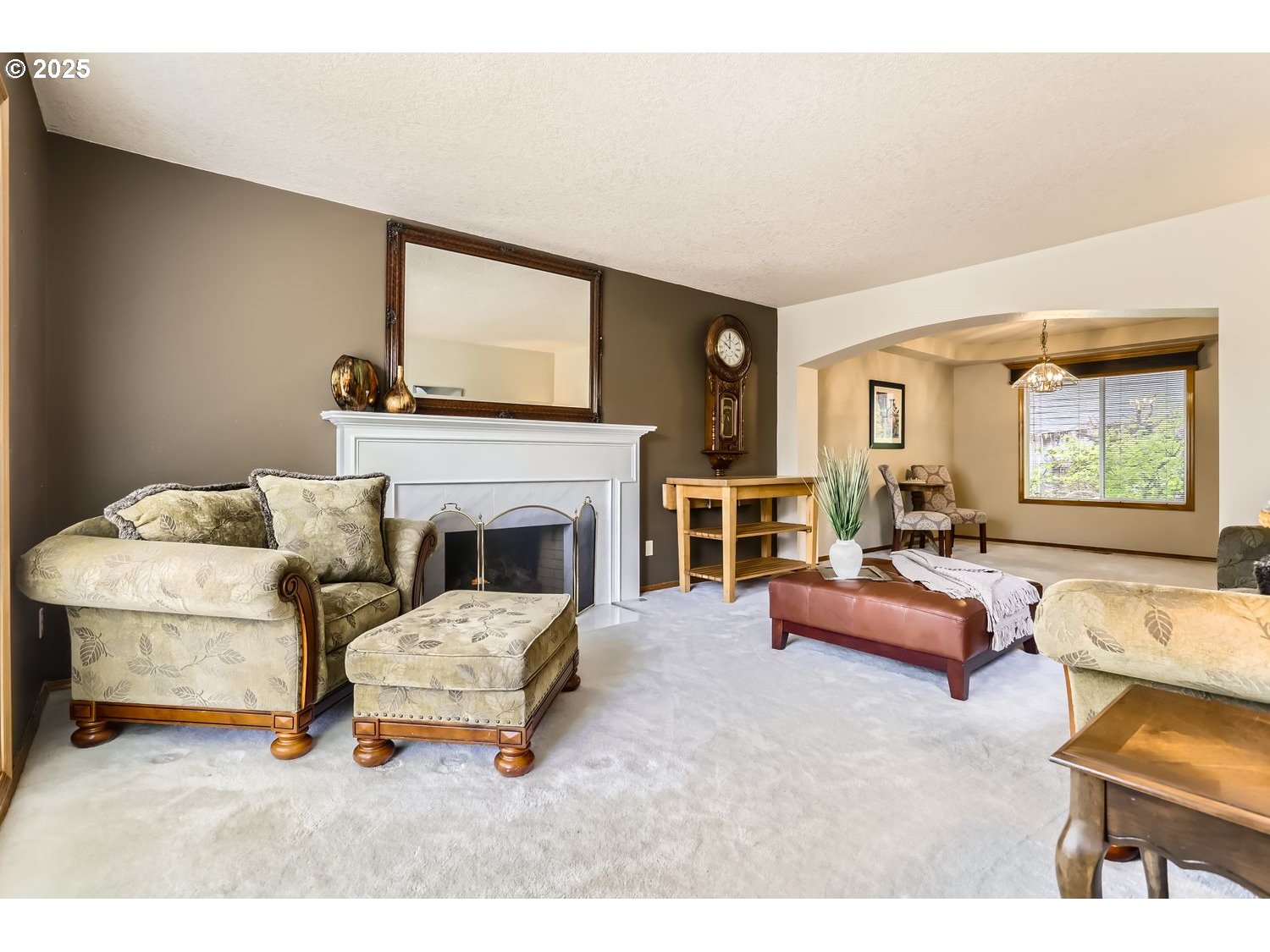 14525 Southwest Chesterfield Lane Portland, OR 97224 - Photo 8 of 31 a living room with furniture and a fireplace