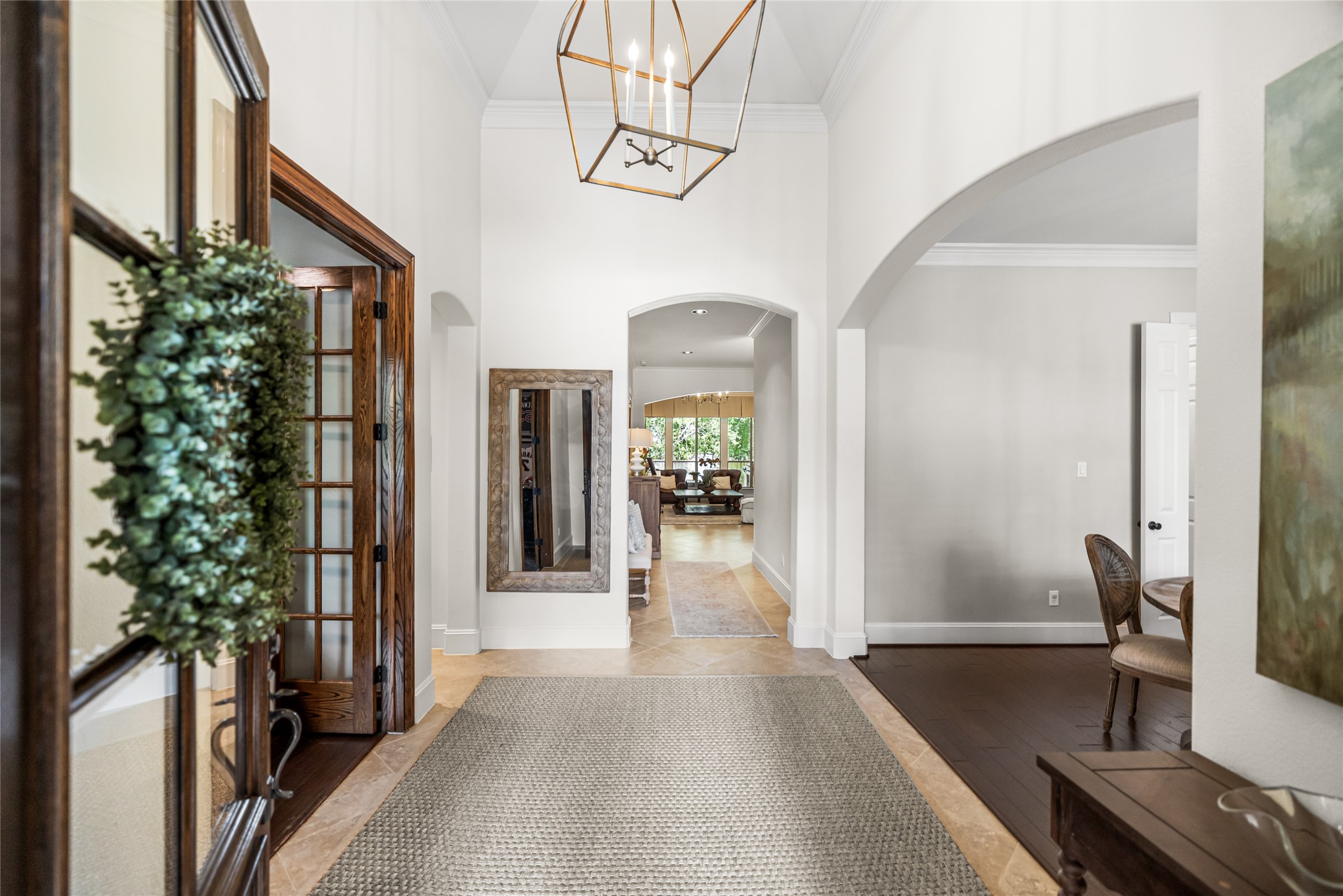 3 Mohawk Path Place Spring, TX 77389 - Photo 2 of 38 Step up to the home and be greeted by a new custom front door, soaring ceilings, and designer lighting that create an inviting first impression and set the tone for the stylish interior beyond.