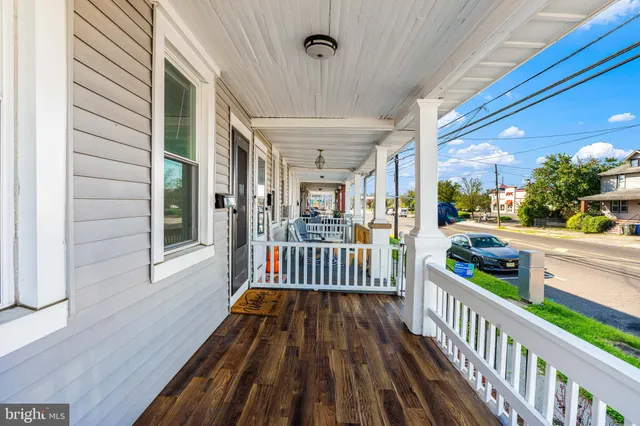 a view of a porch with wooden floor