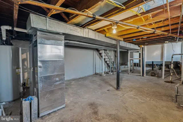 a view of a room with wooden shelves
