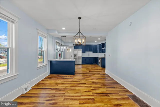 a view of kitchen with wooden floor