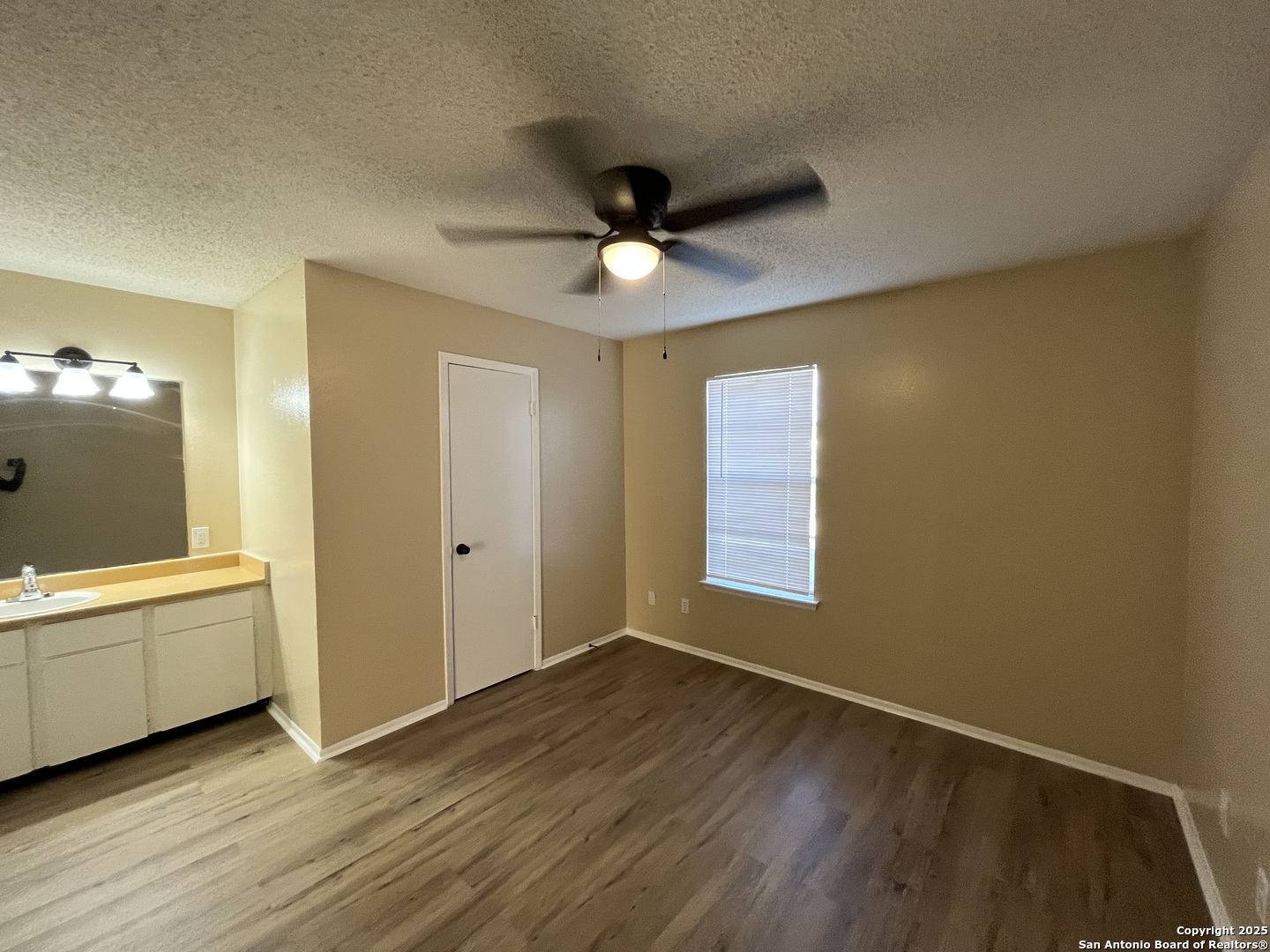 300 Moursund Boulevard, Unit 9 San Antonio, TX 78221 - Photo 7 of 10 a view of a livingroom with a chandelier fan and windows