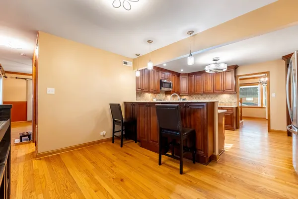 a view of a kitchen and dining room