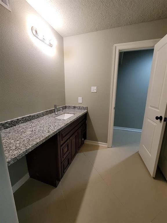 123 Pinehurst Drive Sour Lake, TX 77659 - Photo 12 of 23 a bathroom with a sink and a mirror
