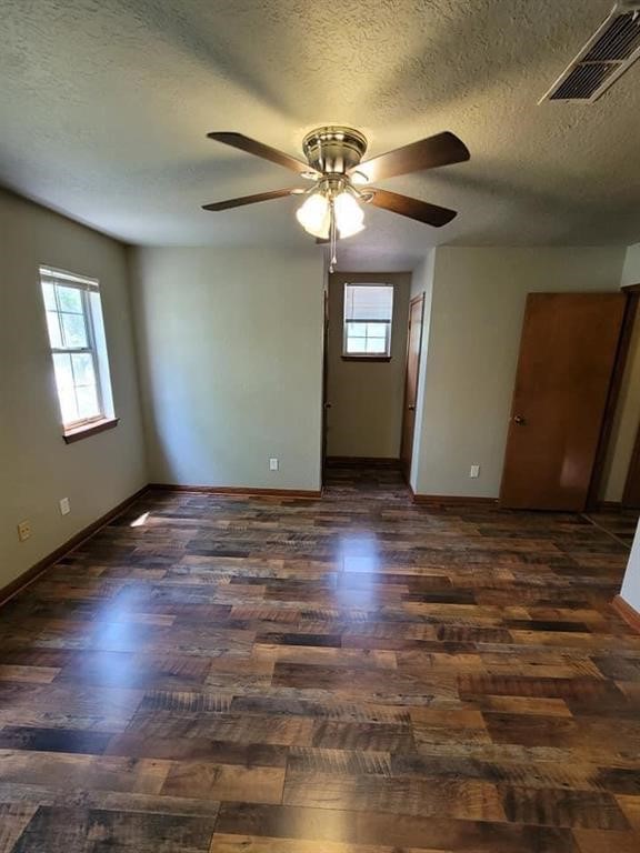 123 Pinehurst Drive Sour Lake, TX 77659 - Photo 17 of 23 a view of an empty room with window and wooden floor