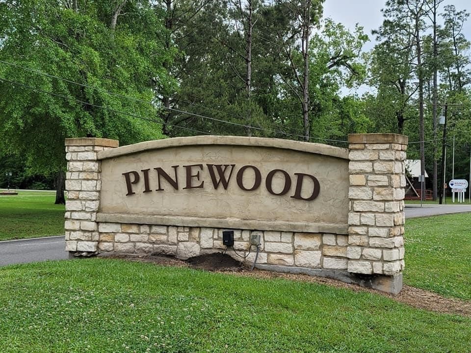 123 Pinehurst Drive Sour Lake, TX 77659 - Photo 23 of 23 a view of a sign board with a big yard