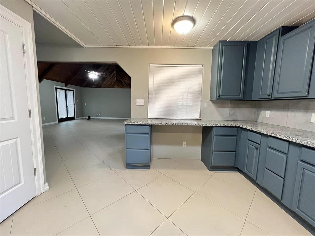 123 Pinehurst Drive Sour Lake, TX 77659 - Photo 4 of 23 a kitchen with granite countertop a sink and a stove