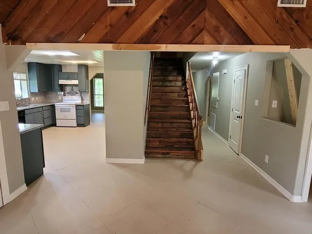 a view of an empty room with a fireplace