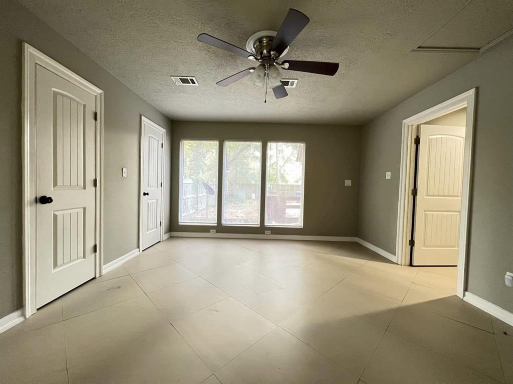 123 Pinehurst Drive Sour Lake, TX 77659 - Photo 10 of 23 a view of an empty room with a window