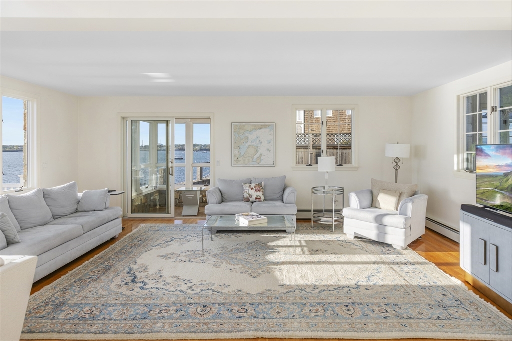89 Naugus Avenue Marblehead, MA 01945 - Photo 11 of 39 a living room with furniture and a rug