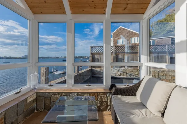 a dining room with furniture and windows