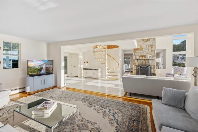 a kitchen with stainless steel appliances granite countertop a sink and a refrigerator