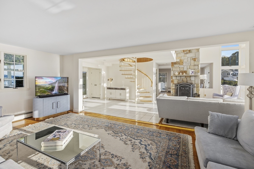 89 Naugus Avenue Marblehead, MA 01945 - Photo 13 of 39 a living room with furniture and a flat screen tv