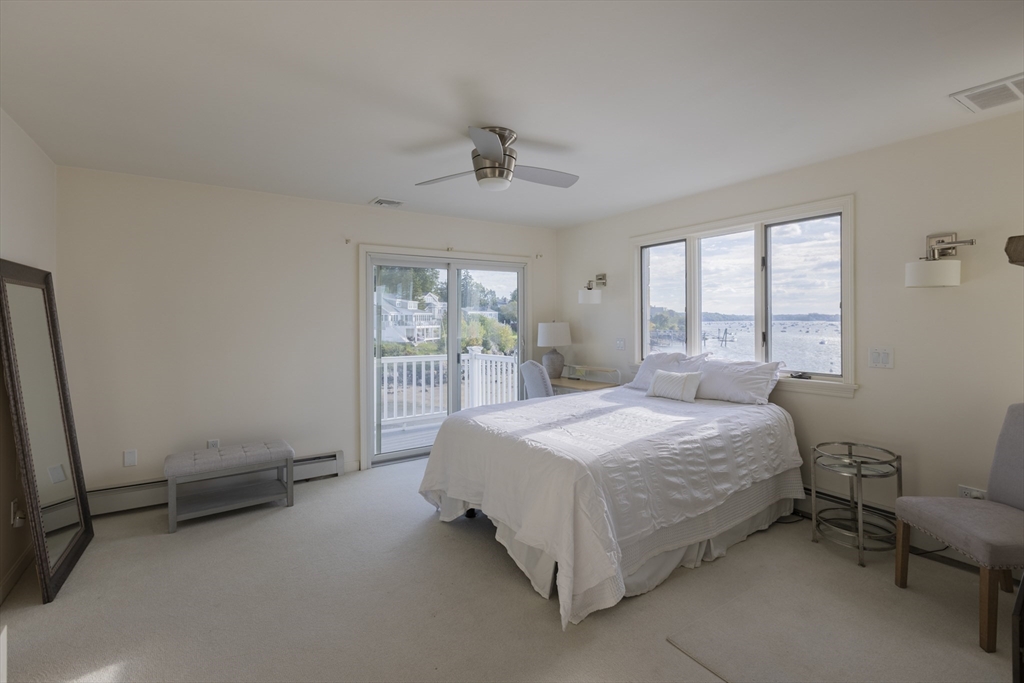 89 Naugus Avenue Marblehead, MA 01945 - Photo 19 of 39 a bedroom with a bed and a window