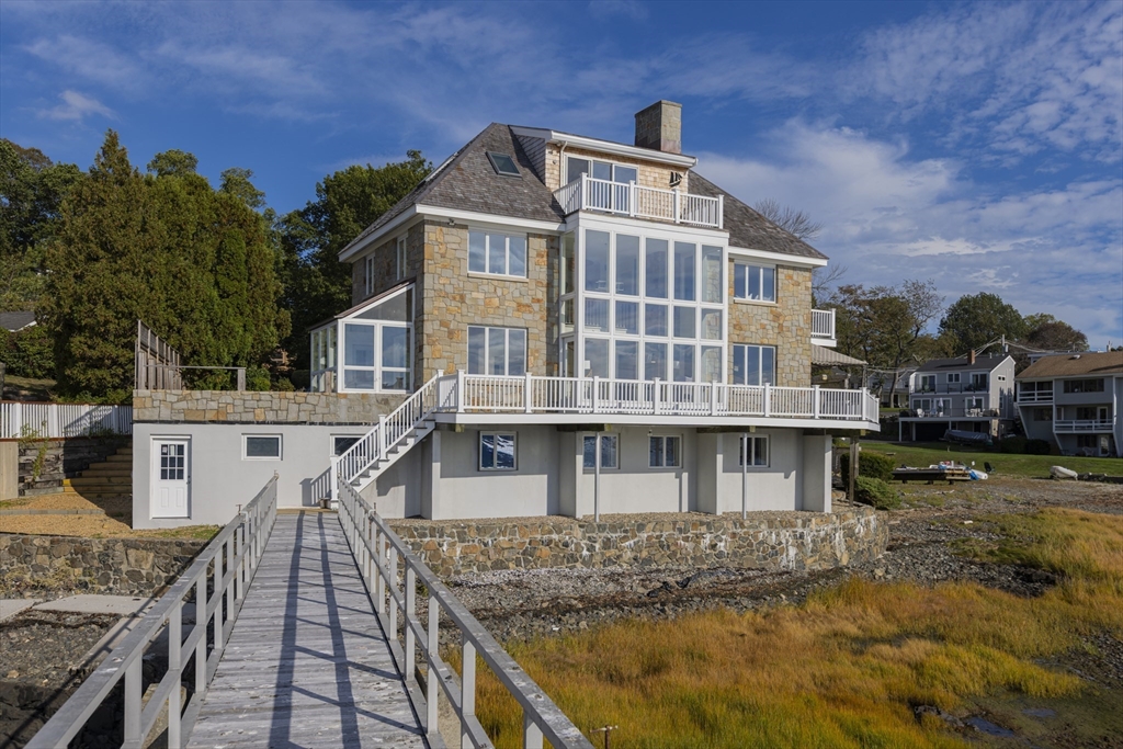 89 Naugus Avenue Marblehead, MA 01945 - Photo 3 of 39 a front view of a house with a yard