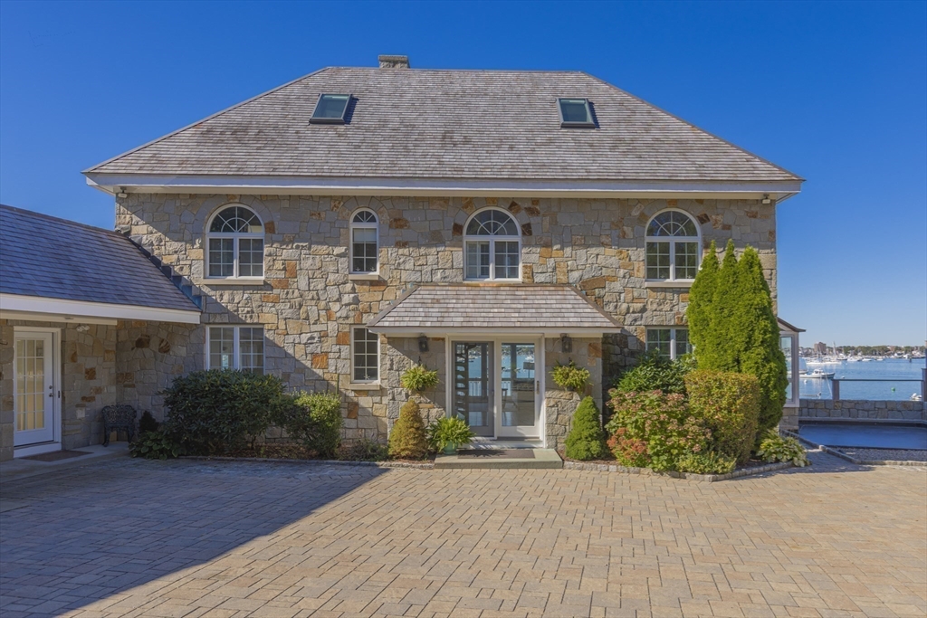 89 Naugus Avenue Marblehead, MA 01945 - Photo 31 of 39 a front view of a house with a garden