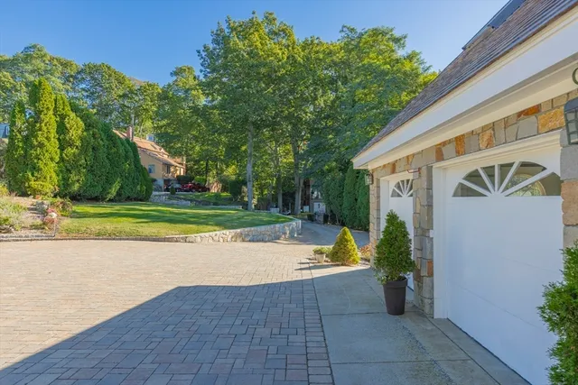 a view of a lake with a house in the background