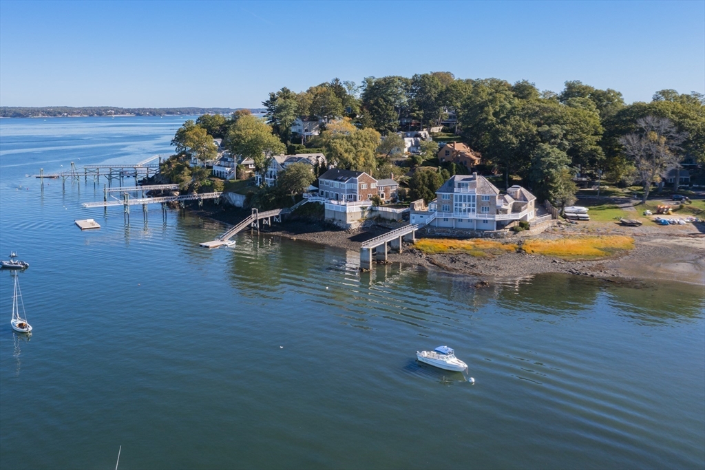 89 Naugus Avenue Marblehead, MA 01945 - Photo 37 of 39 a view of a lake with lawn chairs