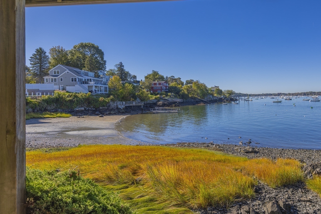 89 Naugus Avenue Marblehead, MA 01945 - Photo 39 of 39 a view of a lake with a house in the background
