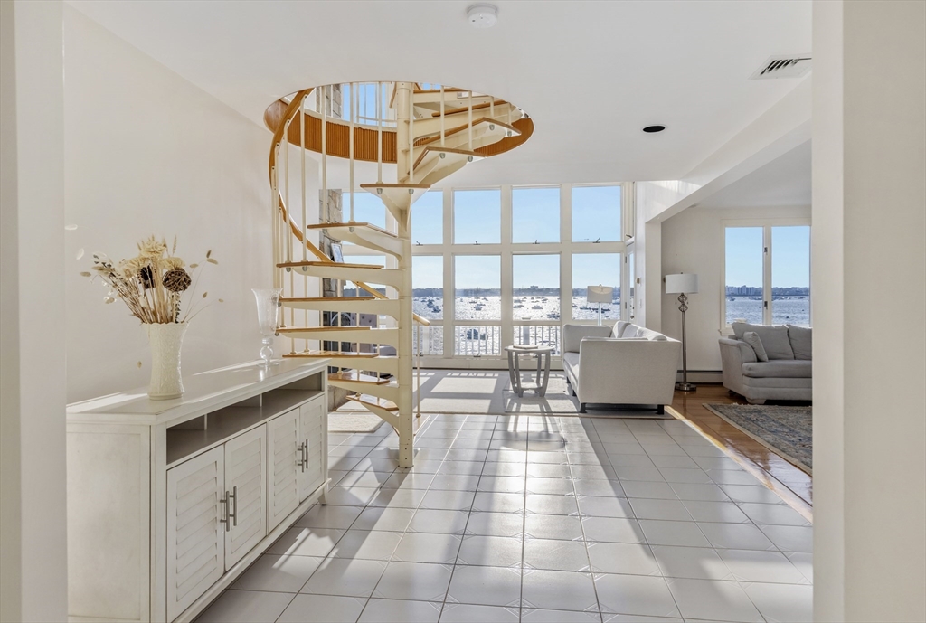 89 Naugus Avenue Marblehead, MA 01945 - Photo 6 of 39 a kitchen with stainless steel appliances a sink and cabinets