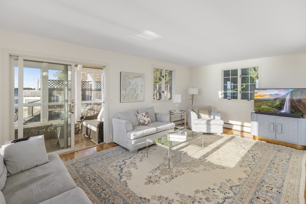 89 Naugus Avenue Marblehead, MA 01945 - Photo 10 of 39 a living room with furniture and a flat screen tv