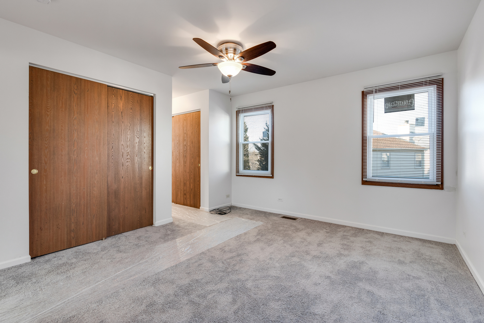 68 Jackson Lane Streamwood, IL 60107 - Photo 13 of 25 a view of an empty room with a ceiling fan