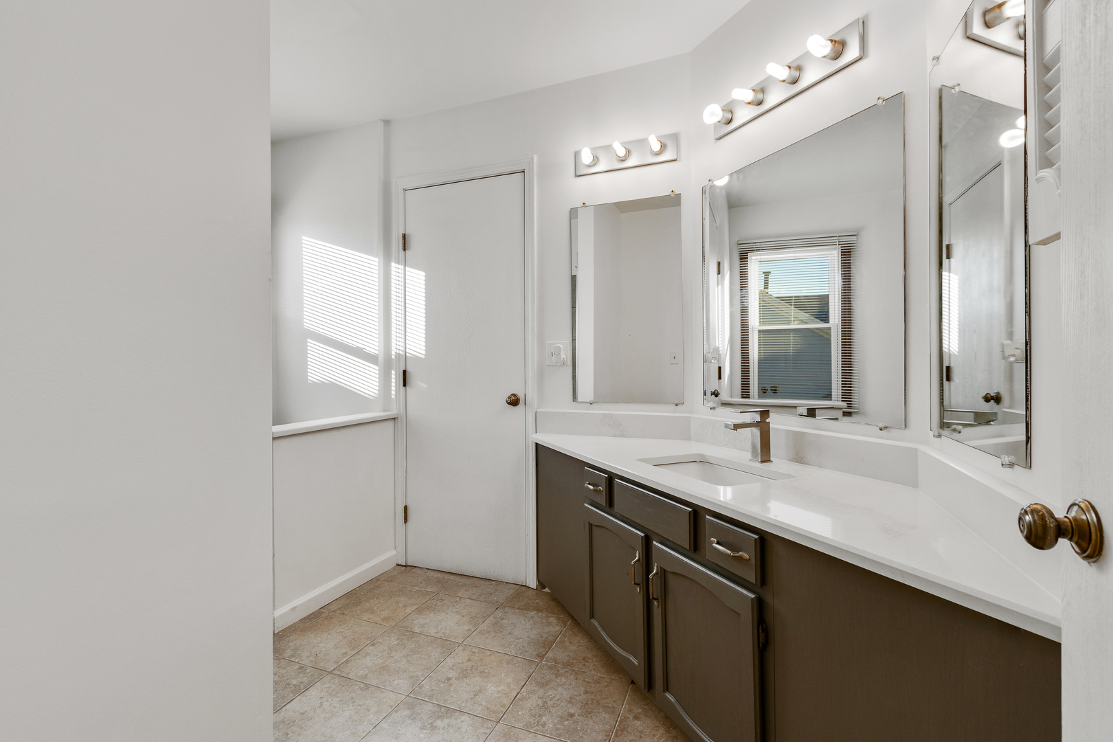 68 Jackson Lane Streamwood, IL 60107 - Photo 16 of 25 a bathroom with a double vanity sink and mirror