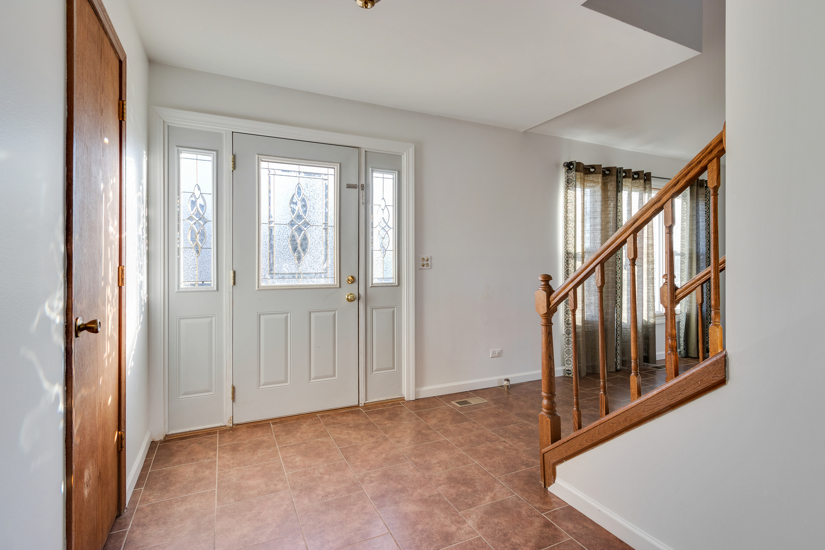 68 Jackson Lane Streamwood, IL 60107 - Photo 3 of 25 a view of an entryway with staircase