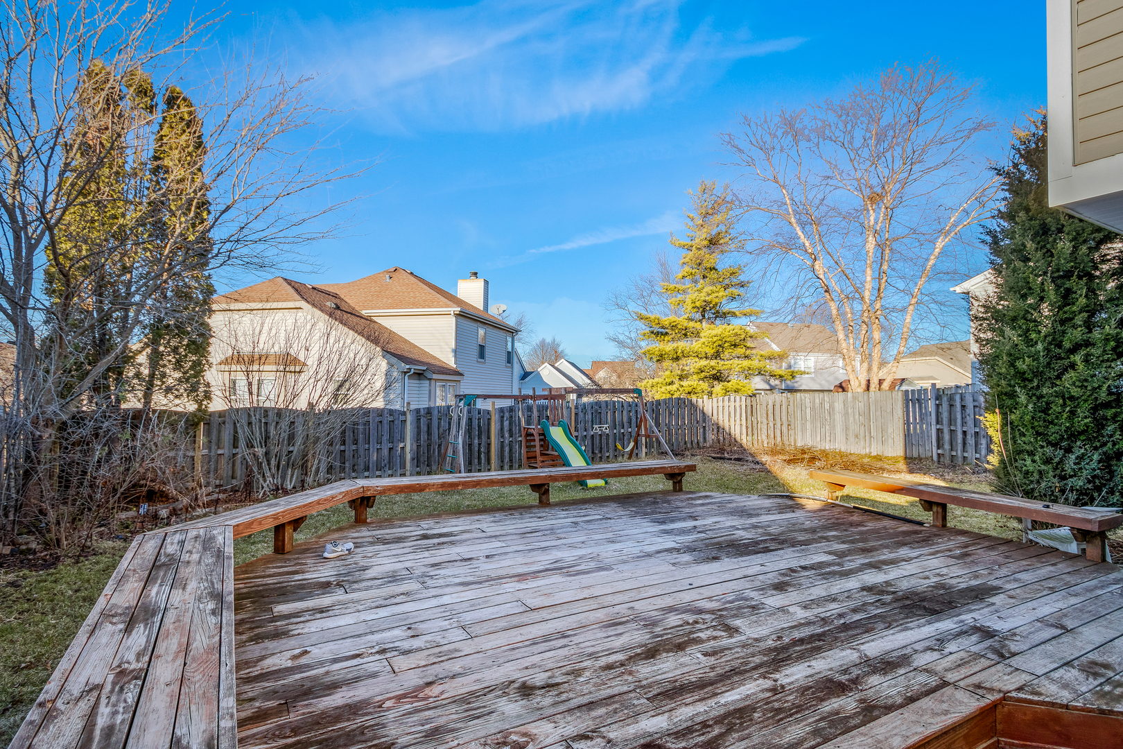 68 Jackson Lane Streamwood, IL 60107 - Photo 23 of 25 a view of swimming pool with lounge chair and wooden fence