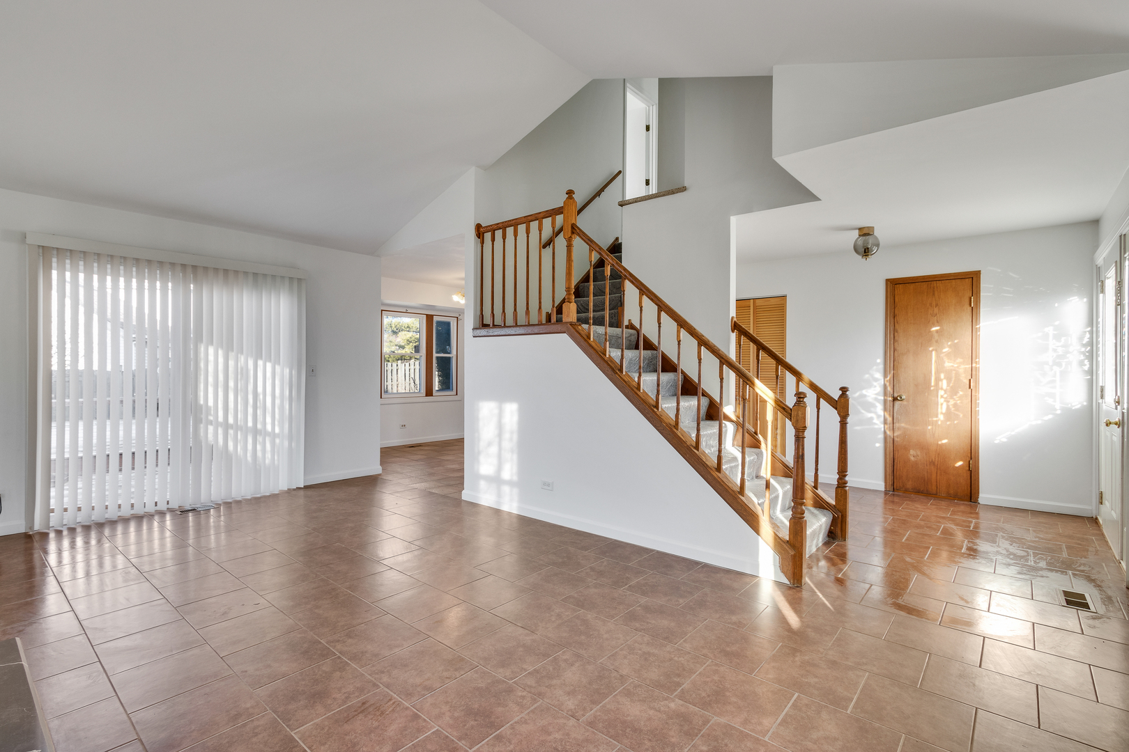 68 Jackson Lane Streamwood, IL 60107 - Photo 6 of 25 a view of entryway and hall with wooden floor