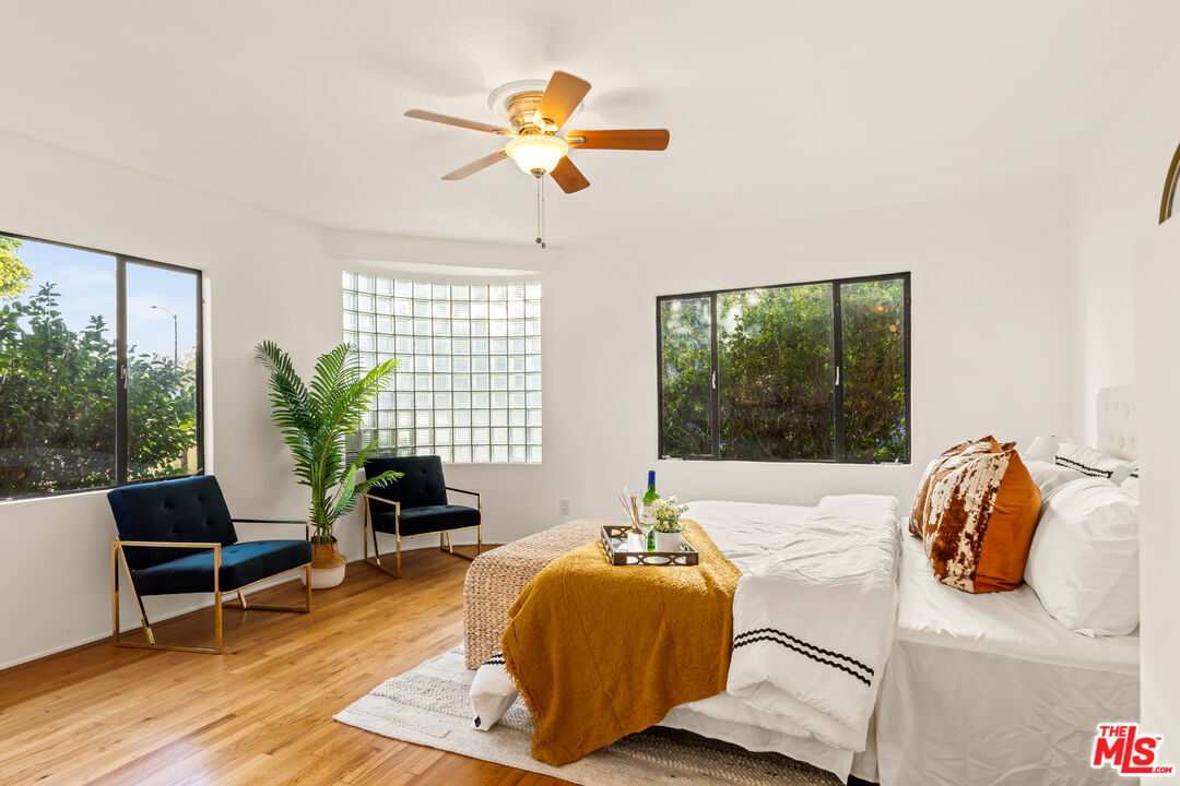 1100 Victoria Avenue Venice, CA 90291 - Photo 15 of 30 a bedroom with a bed and wooden floor
