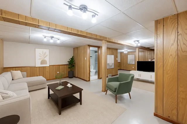 a bathroom with a toilet sink and shower