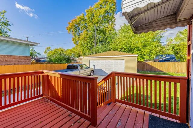 an aerial view of a house with swimming pool garden and patio