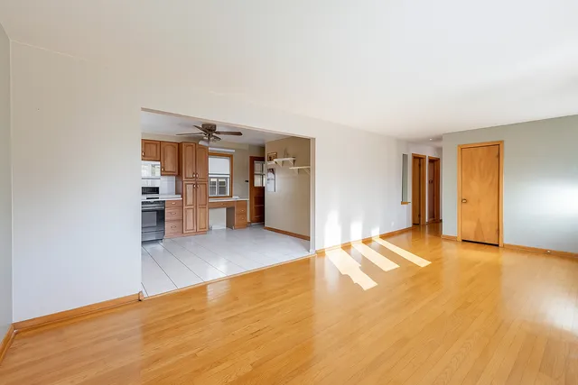 a view of a kitchen with a sink and a refrigerator
