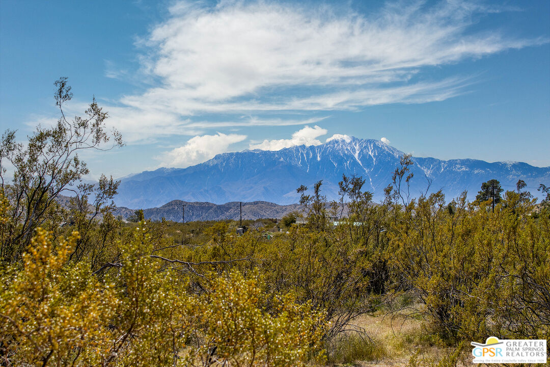 a view of a city with mountains in the background