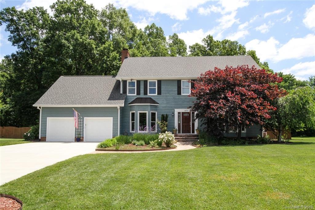 3375 Blue Jay Pass, Unit 10 Fort Mill, SC 29708 - Photo 1 of 30 a front view of a house with a garden