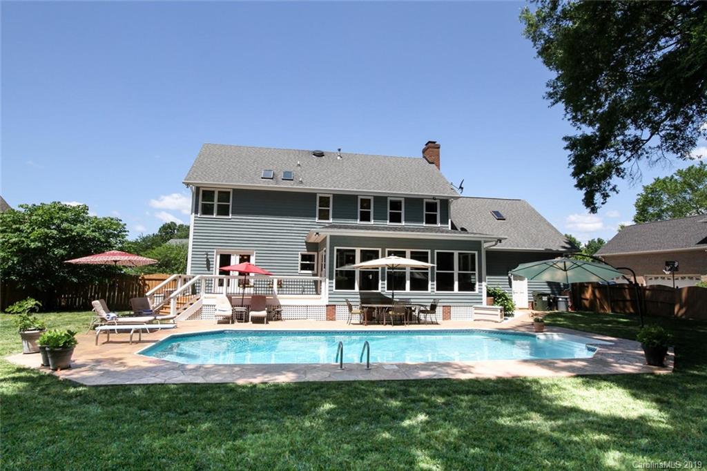 3375 Blue Jay Pass, Unit 10 Fort Mill, SC 29708 - Photo 23 of 30 a front view of a house with garden and swimming pool