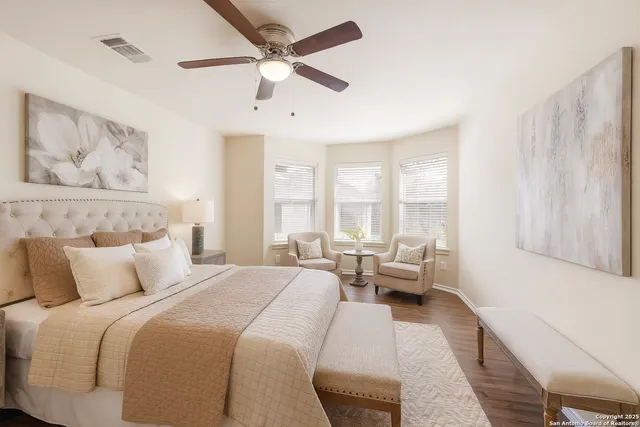 a bedroom with a large bed and a couch