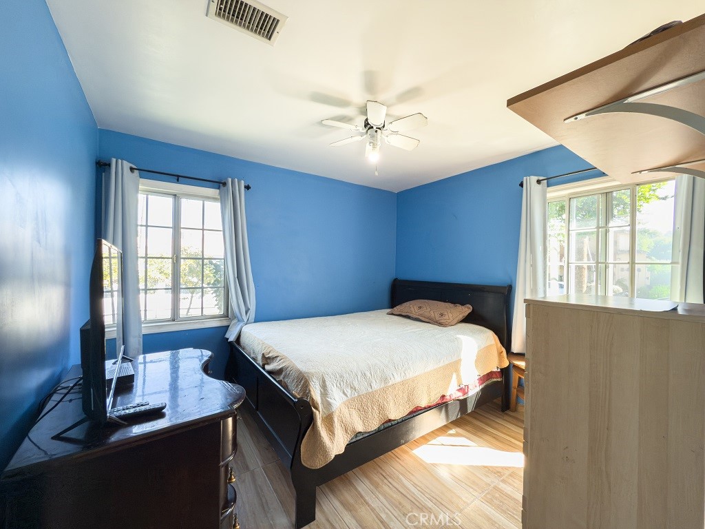 7850 Birchcrest Road Downey, CA 90240 - Photo 12 of 18 a bedroom with a bed table and window