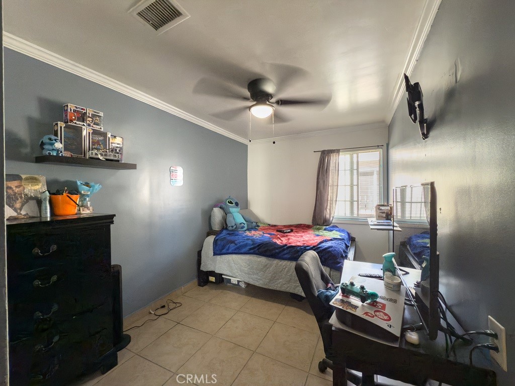 7850 Birchcrest Road Downey, CA 90240 - Photo 13 of 18 a bedroom with furniture and a window