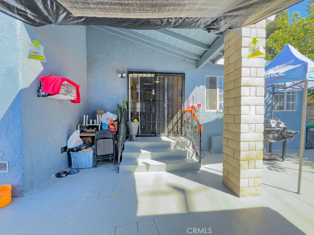 7850 Birchcrest Road Downey, CA 90240 - Photo 16 of 18 a living room with furniture and a potted plant