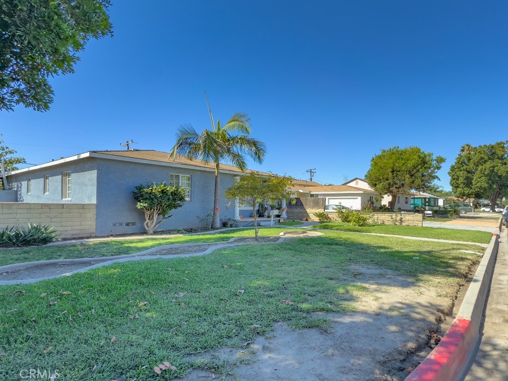 7850 Birchcrest Road Downey, CA 90240 - Photo 2 of 18 a front view of a house with a yard