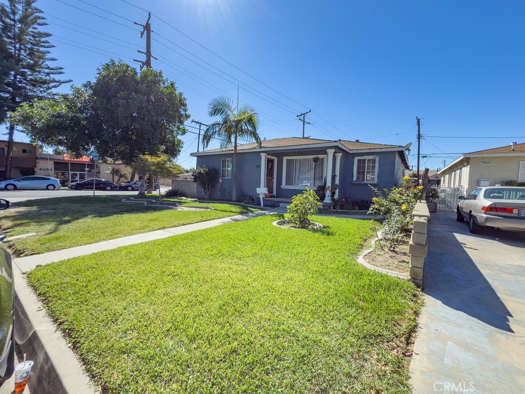 7850 Birchcrest Road Downey, CA 90240 - Photo 3 of 18 a view of a house with a big yard potted plants and large tree